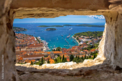 Hvar bay aerial view through stone window
