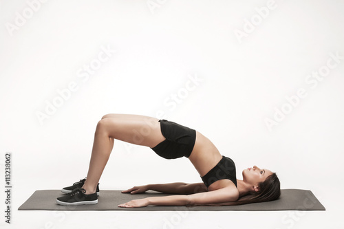 Woman exercising on mat