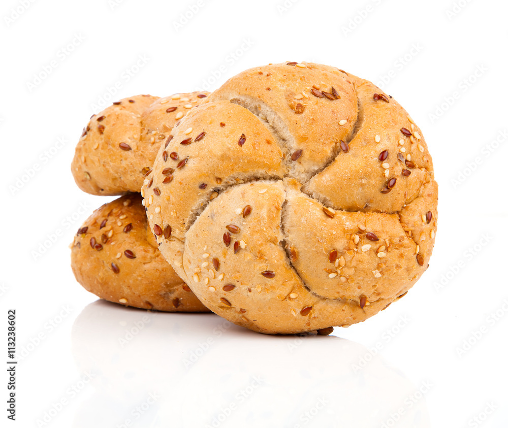 Kaiser roll with sesame seeds, on a white background Kaiser roll with sesame seeds, on a white background
