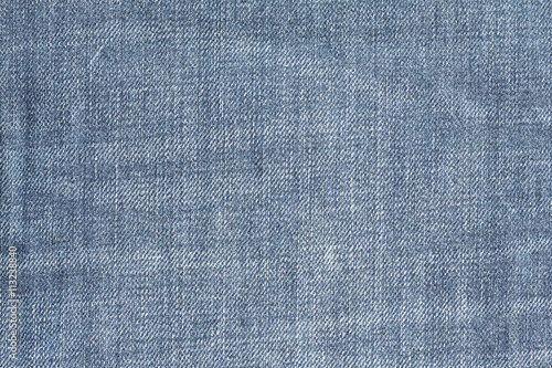 Closeup denim jeans texture. Stitched textured blue denim jeans background. Old grunge vintage denim jeans. Denim jeans of fashion design.