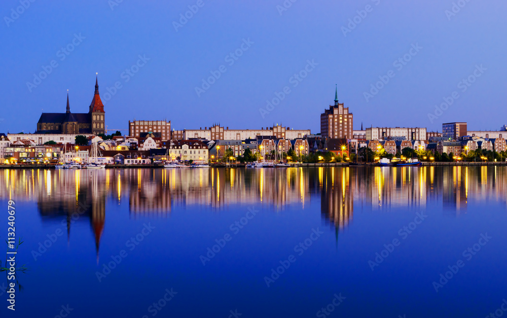 Night Panorama view to Rostock. River Warnow and City port.
