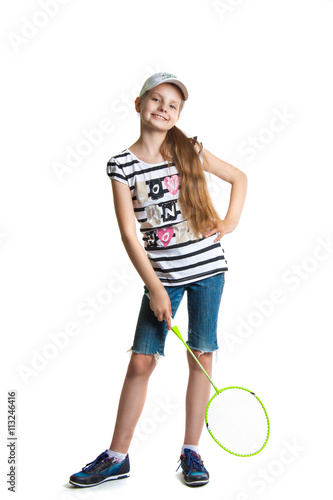 Pretty teen girl plays with a racket for a badminton on a white background. © akvafoto2012
