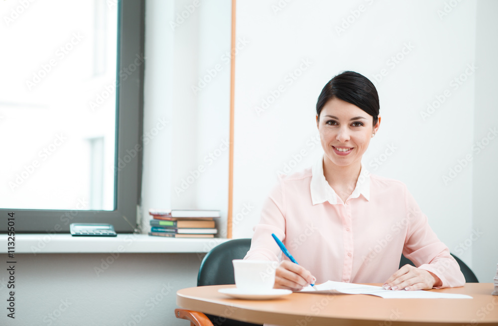 wonam work with papers in office room. wonam work with papers in office room.