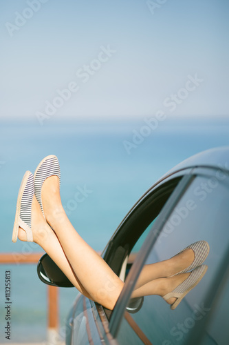 Young woman relaxing in her car