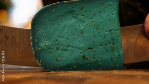 Wallpaper Mural A piece of blue lavender cheese being cut off in a dairy shop Torontodigital.ca