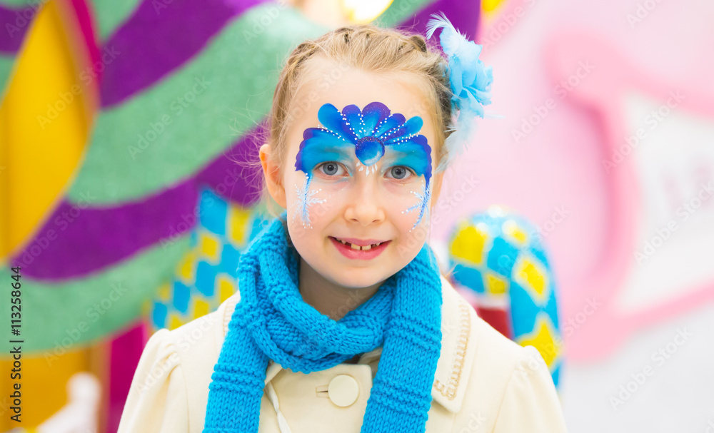 Portrait of little girl with Christmas face painting Portrait of little girl with Christmas face painting