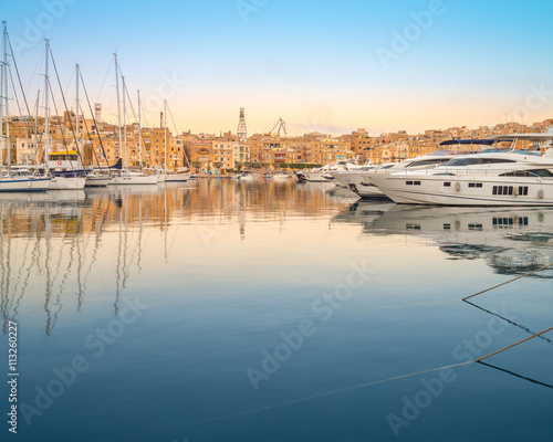 Rows of sailing boats on Senglea marina, Malta photo