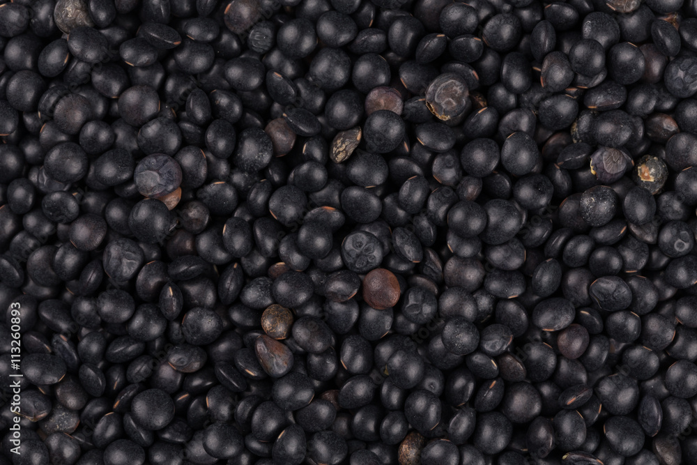 black lentils background closeup black lentils background closeup