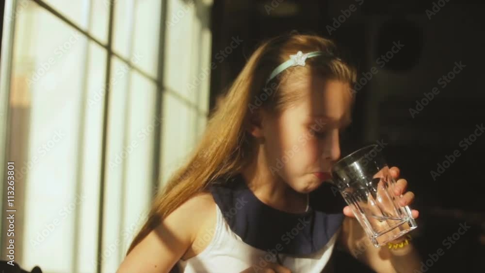 young child enjoys a glass of fresh water young child enjoys a glass of fresh water