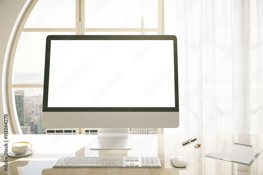 Fototapeta premium Creative desktop with blank monitor