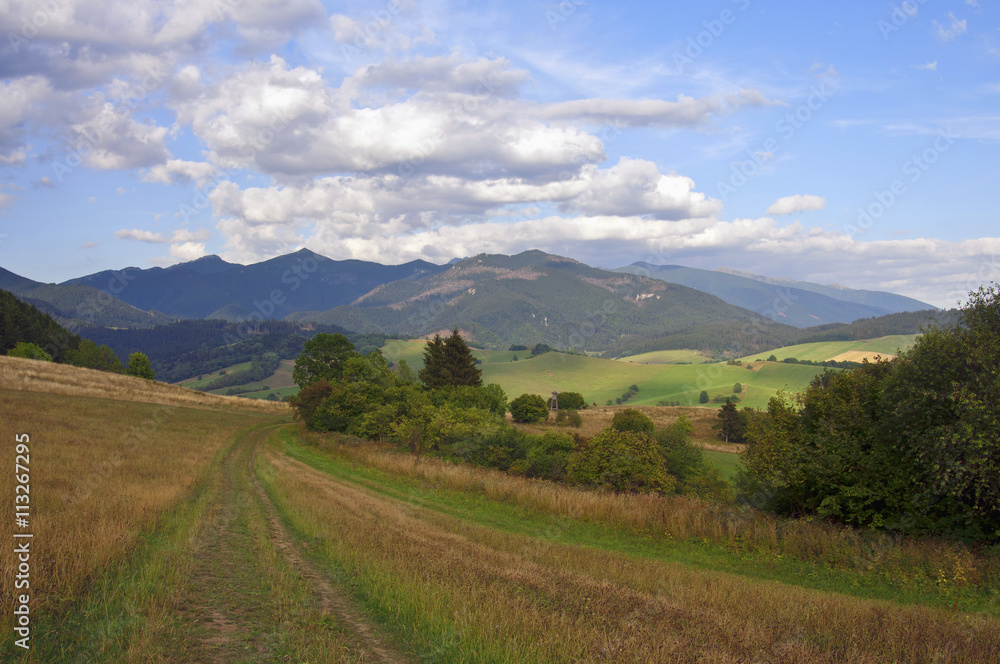 Mountain and clouds in distance landscape