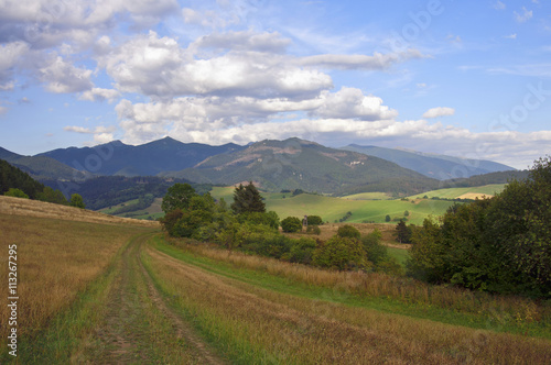 Mountain and clouds in distance landscape