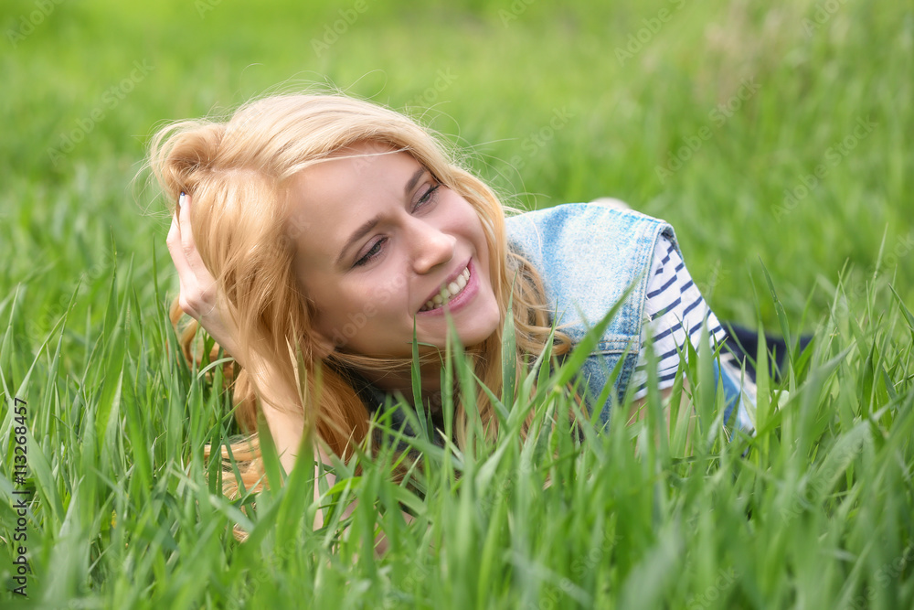 Young beautiful woman on green grass Young beautiful woman on green grass