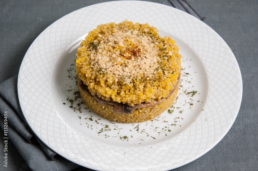 Quinoa risotto dish with mushrooms