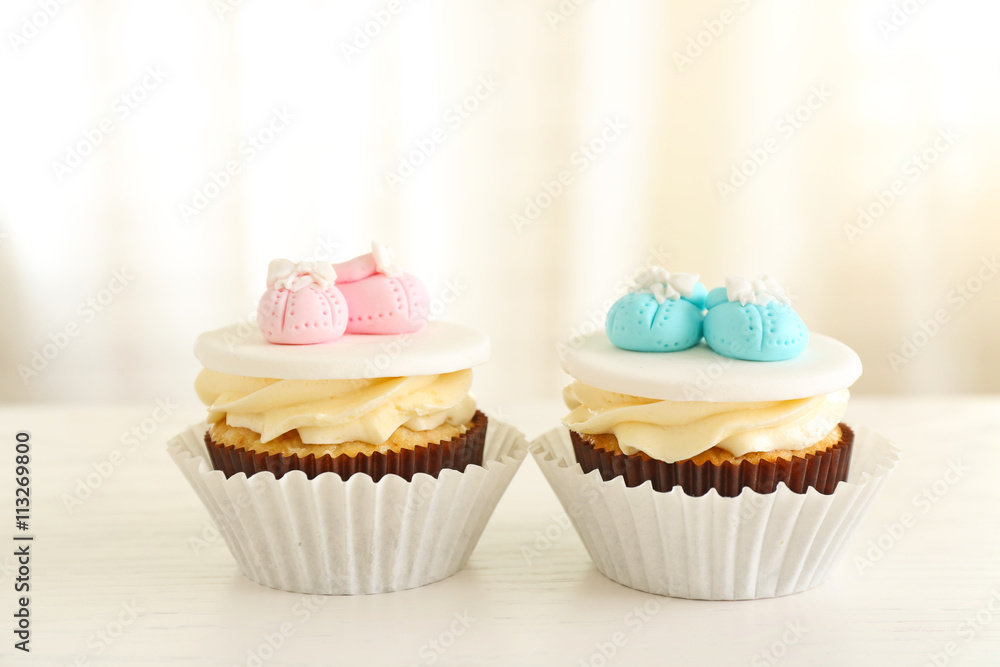 Delicious cupcakes on light background
