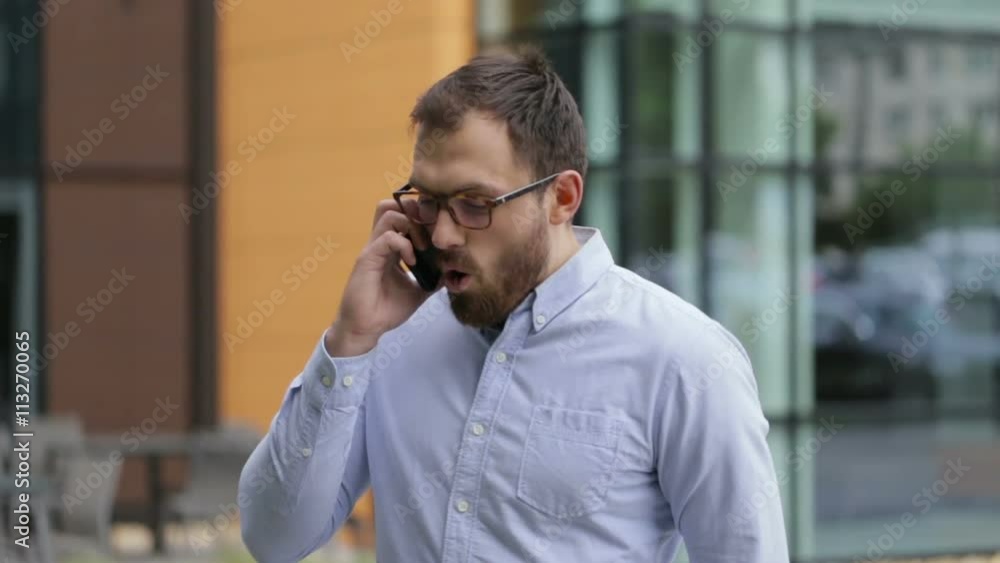 Glad businessman happy to have a nice talk on phone. Glad businessman happy to have a nice talk on phone.