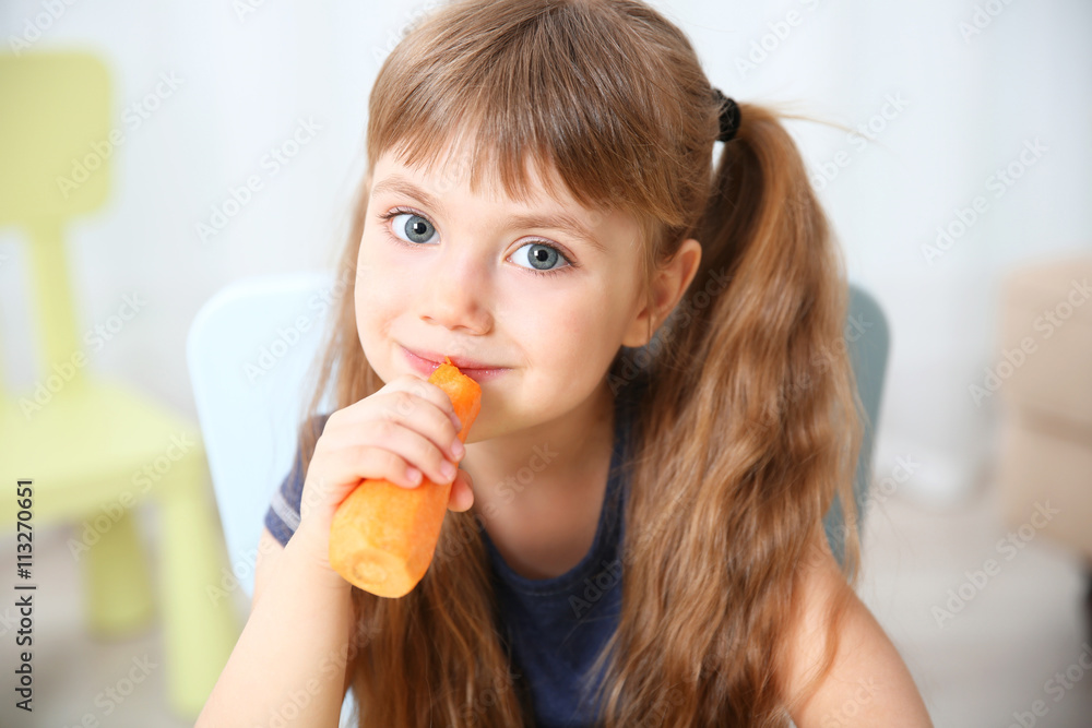 Little girl with carrot in the living room Little girl with carrot in the living room