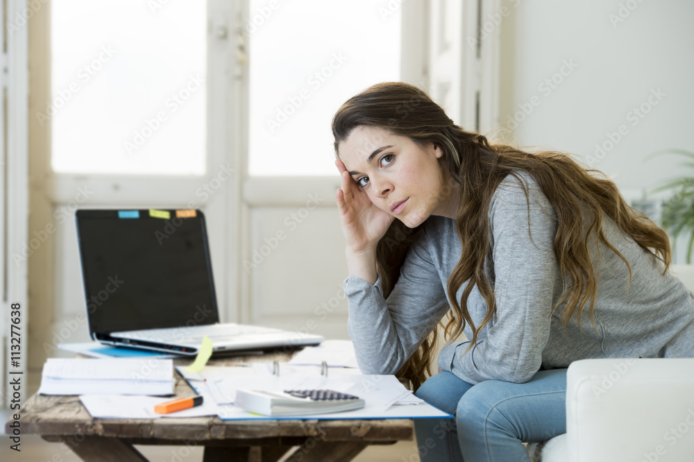 worried woman suffering stress doing domestic accounting paperwork bills and invoices worried woman suffering stress doing domestic accounting paperwork bills and invoices