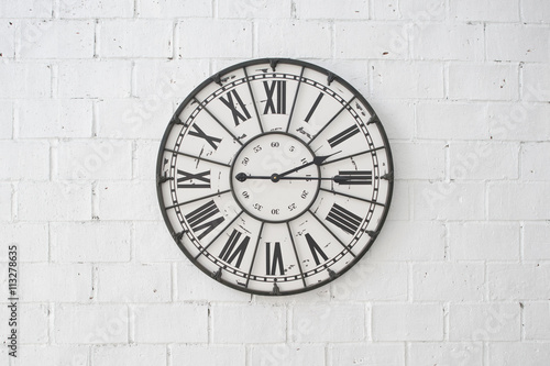 A wall clock on rock wallpaper background
