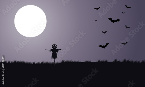 Silhouette of scarecrow and bat Halloween