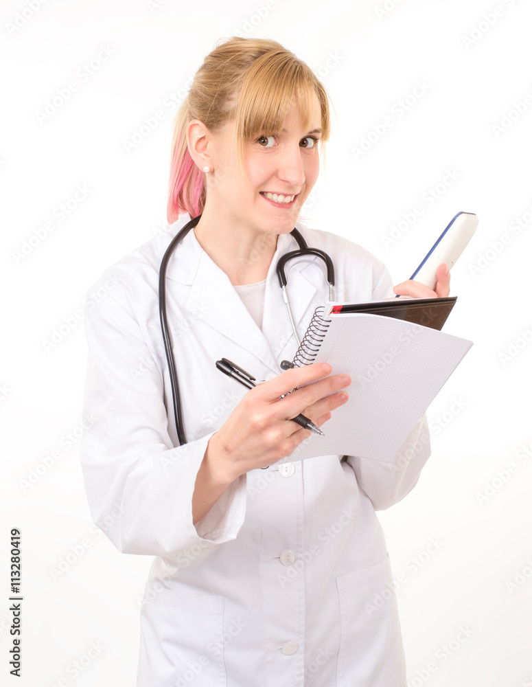 smiling doctor talking on the phone and writes in his book on wh smiling doctor talking on the phone and writes in his book on wh