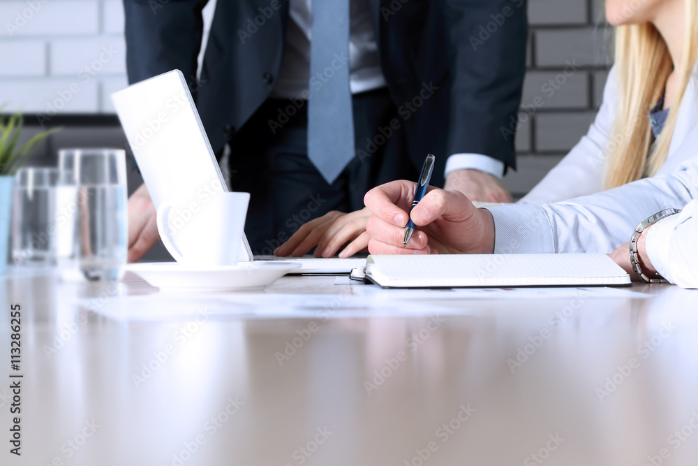 Business colleagues working and analyzing financial figures / gr Business colleagues working and analyzing financial figures / gr