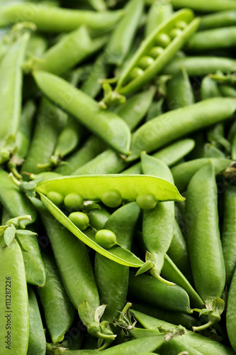 Fresh green peas background, close up