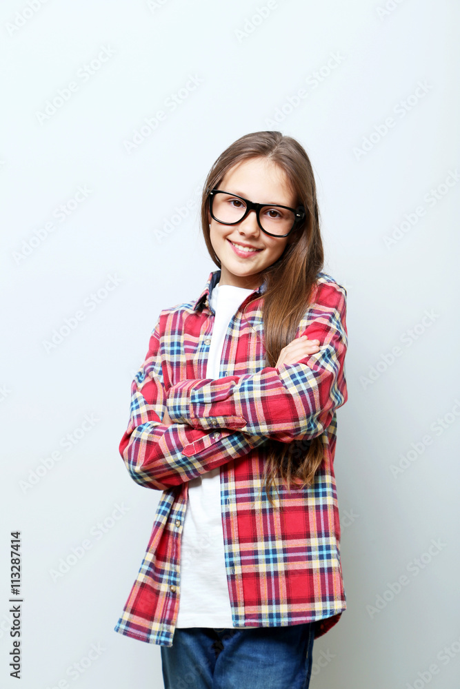 Portrait of young girl on grey background Portrait of young girl on grey background