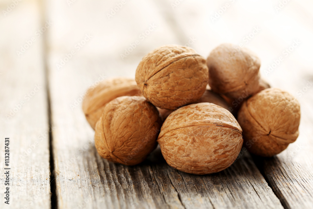 Walnuts on a grey wooden table Walnuts on a grey wooden table