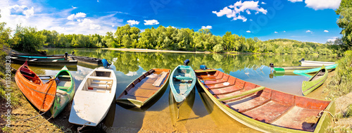 Colorful boats on Mura Drava mouth photo