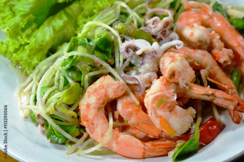 sunflower sprout with prawn and squid spicy salad on dish sunflower sprout with prawn and squid spicy salad on dish