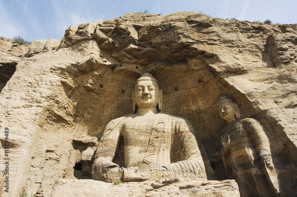 Buddhist statues of Yungang Caves cut during the Northern Wei Dynasty in 460 AD near Datong, Shanxi province, China Buddhist statues of Yungang Caves cut during the Northern Wei Dynasty in 460 AD near Datong, Shanxi province, China