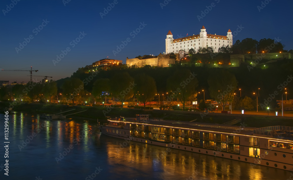 Illuminated Bratislava castle hill at night, Slovakia