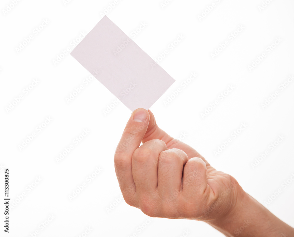 Male hand holding an empty business card Male hand holding an empty business card