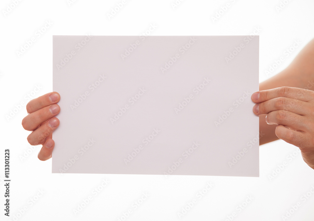 Fototapeta premium Unrecognizable man holding an empty sheet of paper