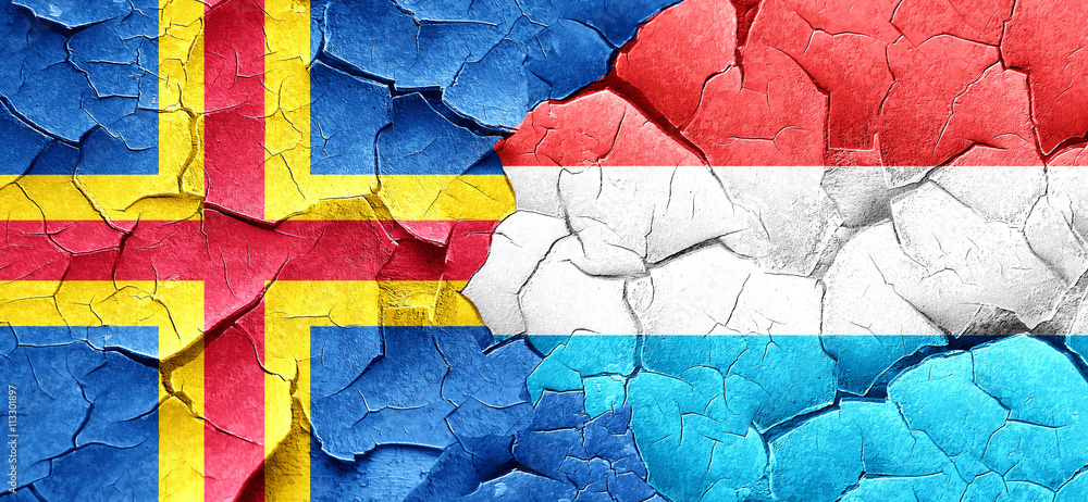 aland islands with Luxembourg flag on a grunge cracked wall
