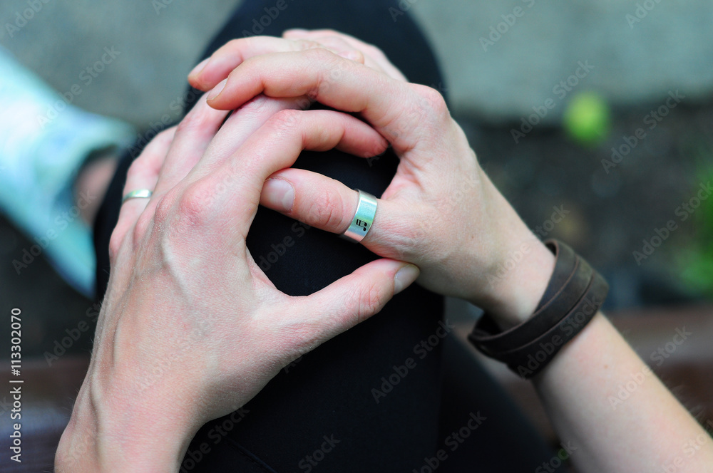 Hands of pianist with musical note on the silver ring Hands of pianist with musical note on the silver ring