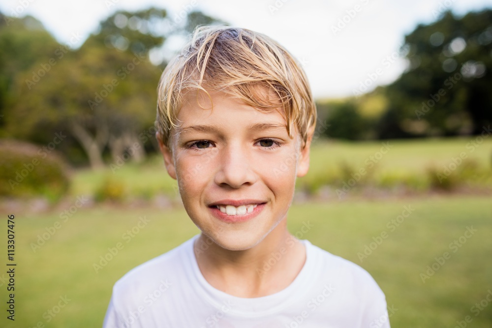 Kid posing at camera during a sunny day Kid posing at camera during a sunny day