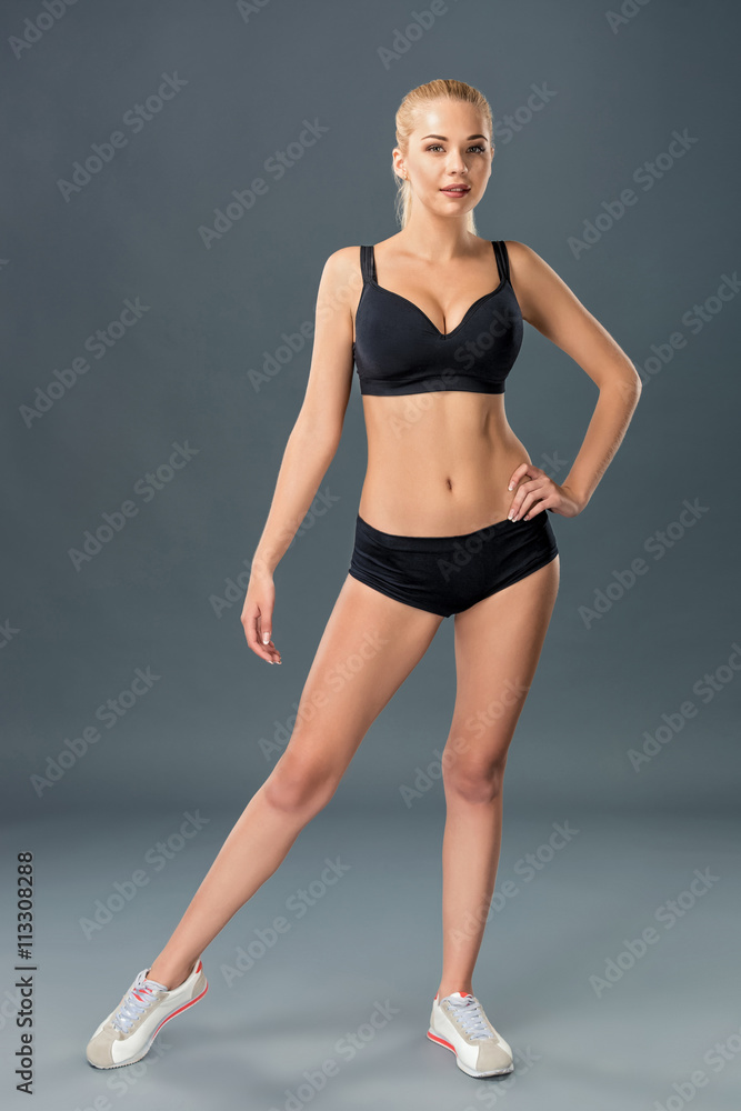 Young beautiful woman in fitness wear trained female body Young beautiful woman in fitness wear trained female body