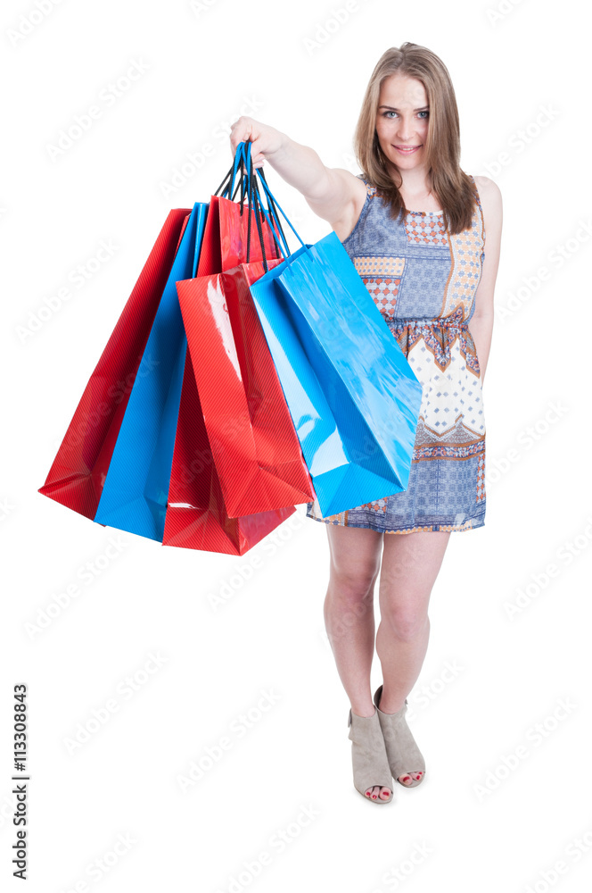 Young caucasian female doing shopping and offers colored bags