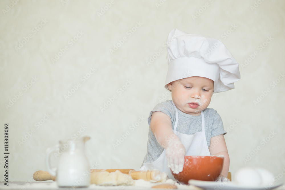 The little boy in a suit of the cook The little boy in a suit of the cook