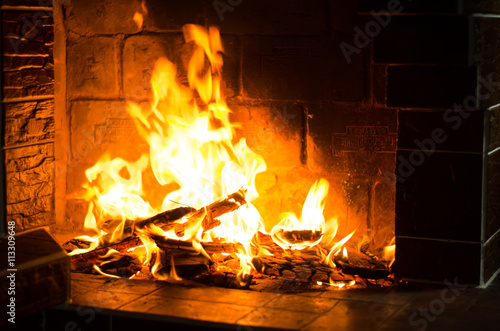 Fire burns in a fireplace 