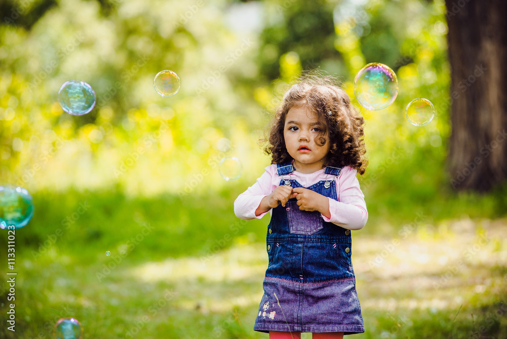 Portrait of cute girl blowing soap bubbles Portrait of cute girl blowing soap bubbles