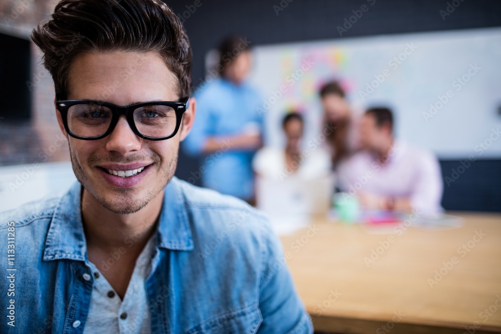Portrait of a hipster and group of coworkers Portrait of a hipster and group of coworkers