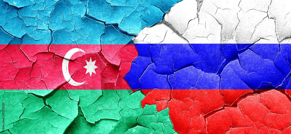 Azerbaijan flag with Russia flag on a grunge cracked wall