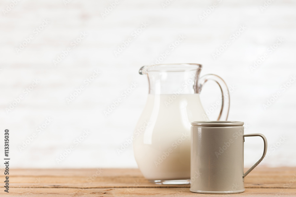 Milk jar on wooden table Milk jar on wooden table