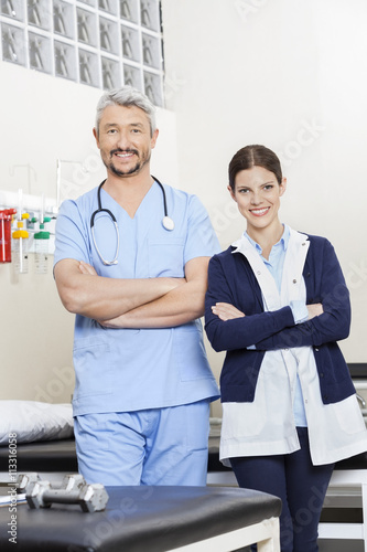 Physiotherapists With Arms Crossed Standing In Rehab Center