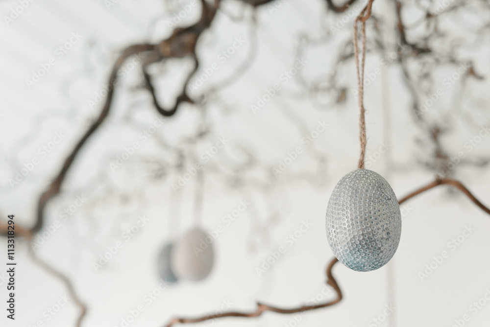 Decorative easter eggs hanging from a twig Decorative easter eggs hanging from a twig