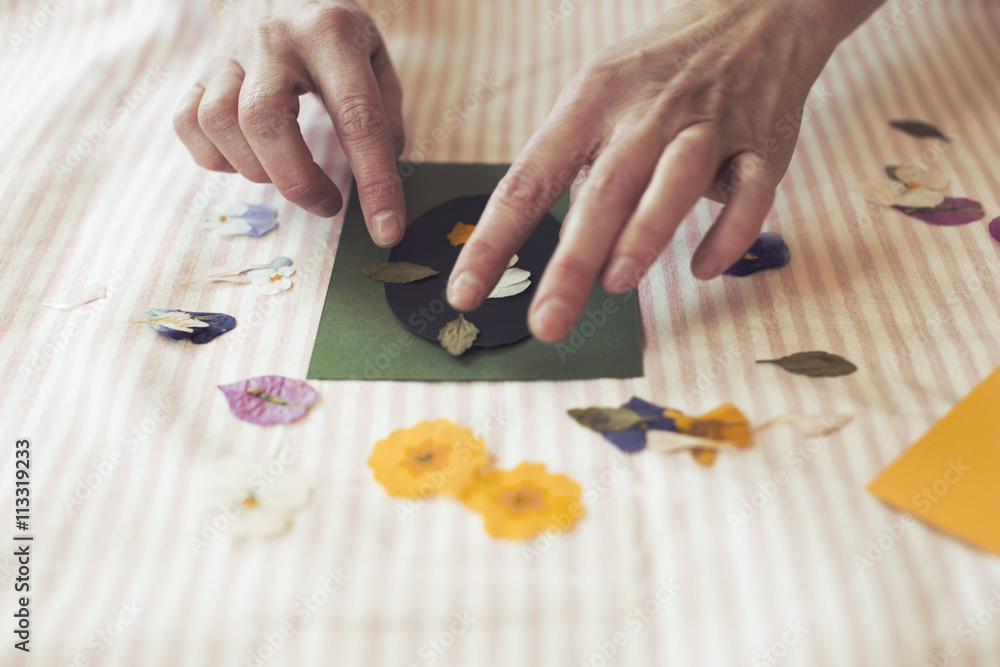 Cropped image of woman making paper craft product on table Cropped image of woman making paper craft product on table