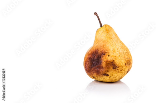 Rotten and decomposing pear on white background